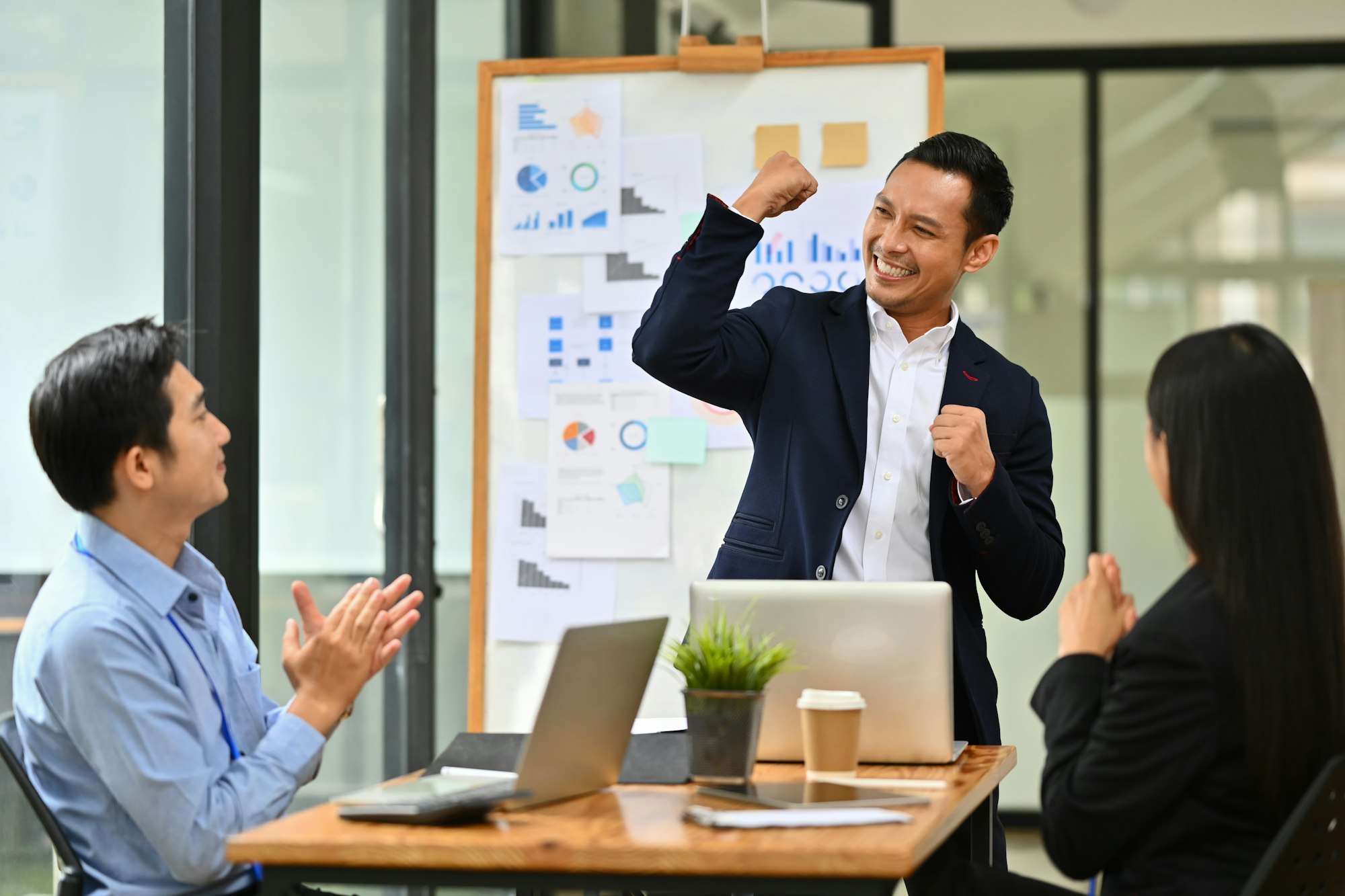 Business people celebrating corporate success win partnership power.