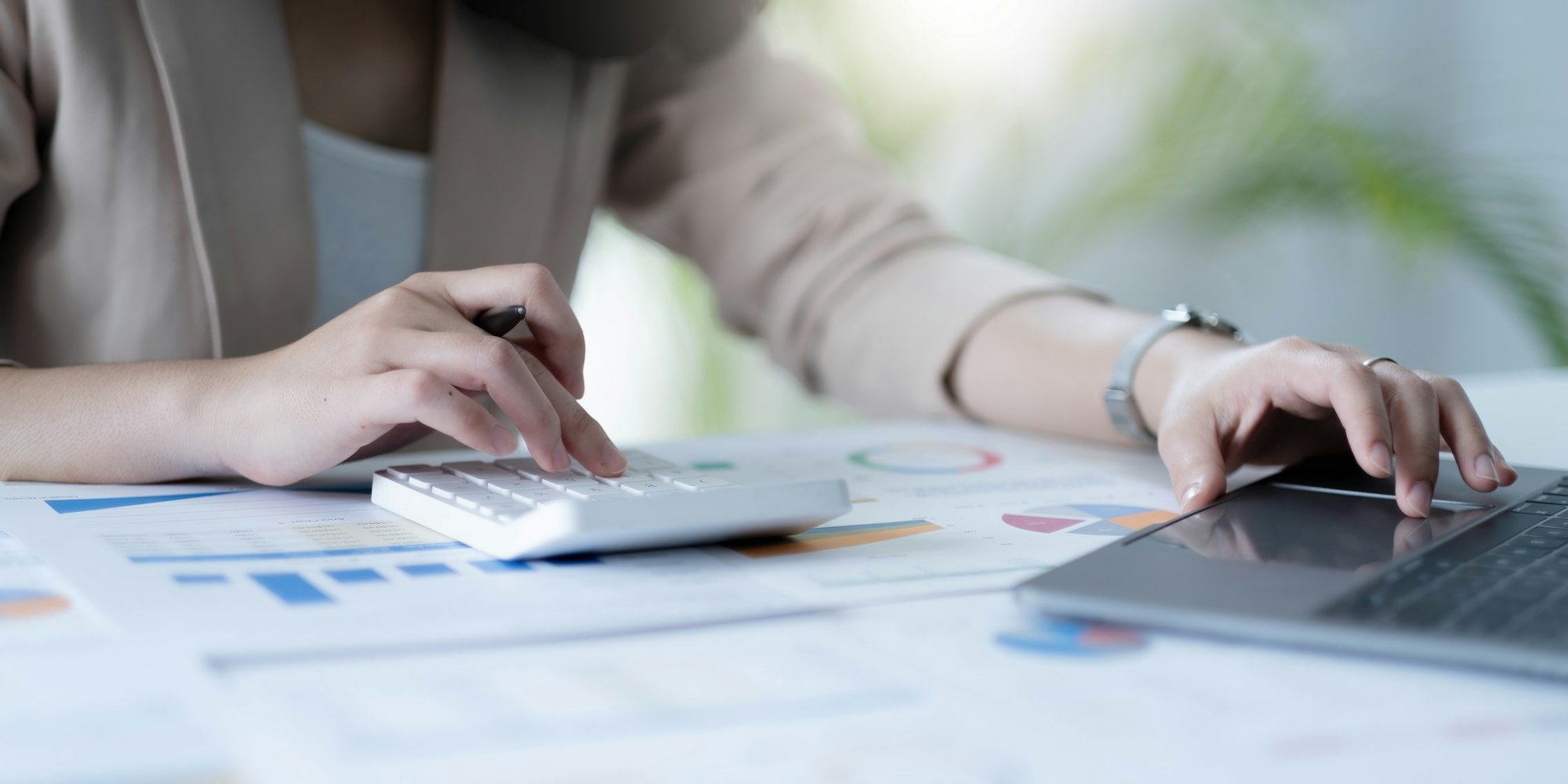employee accountant woman hand press on calculator for make financial report or company's profit
