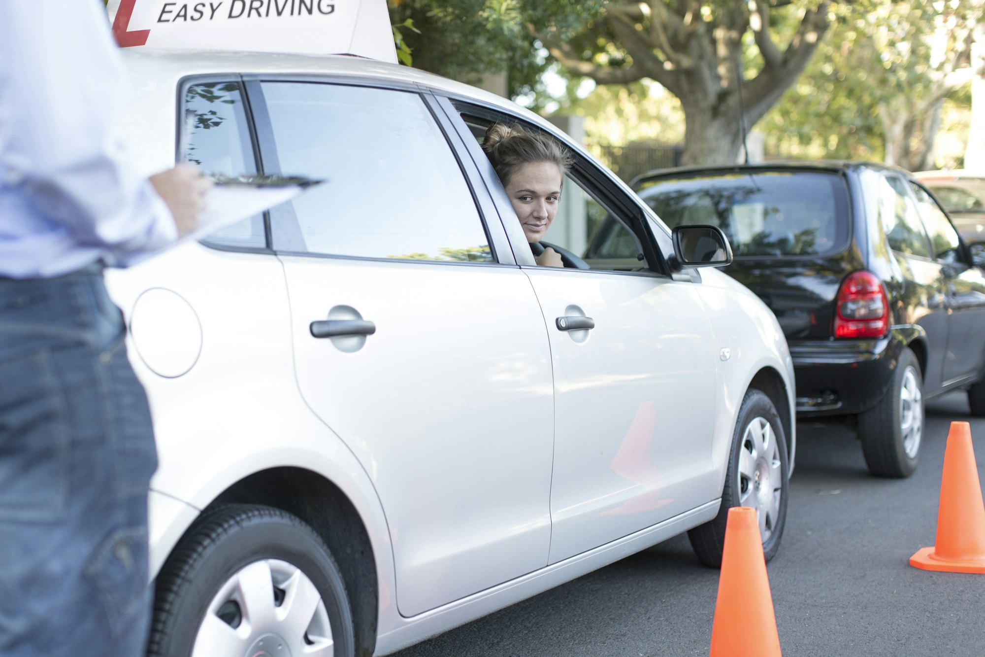 Teenage girl during driving license test