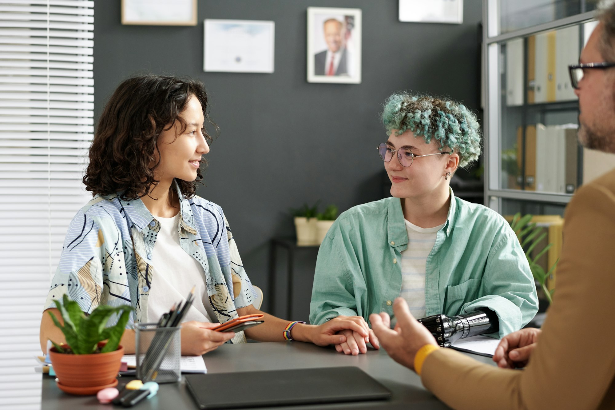 Young girls having meeting with advisor